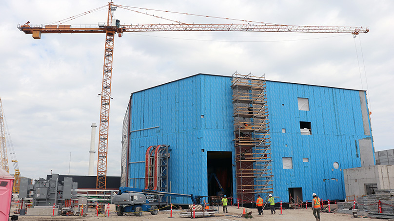 construction crews working on a large building