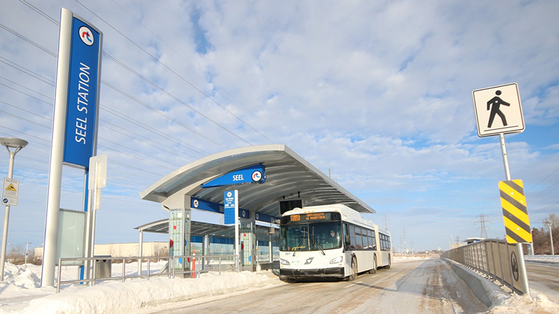 Winnipeg Transit bus at a stop in winter