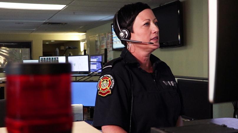 WFPS employee taking at the 911 call centre