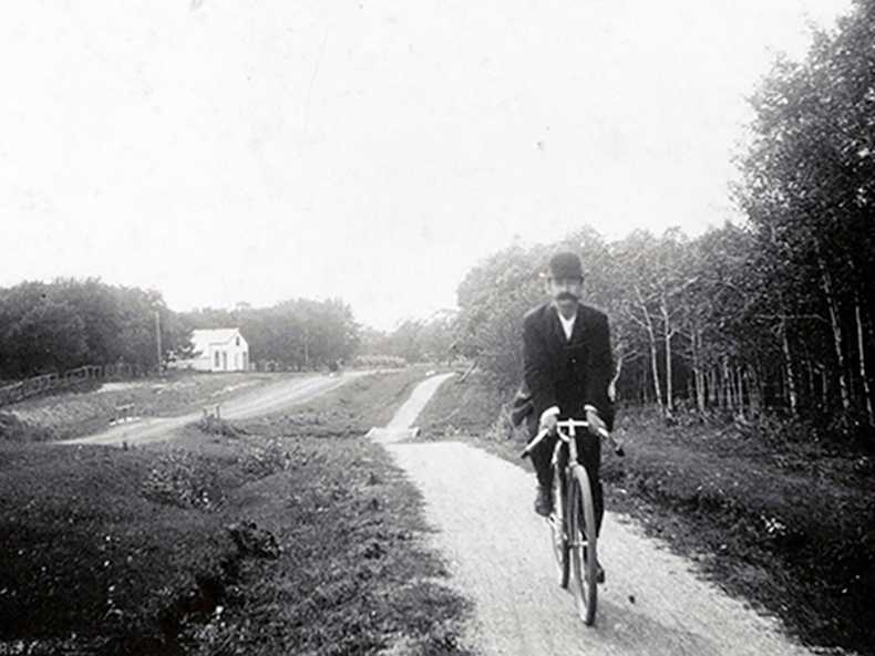 Cyclist on Portage Avenue circa 1900