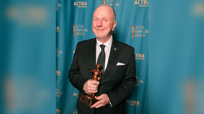 Kenny Boyce holding his ACTRA Award