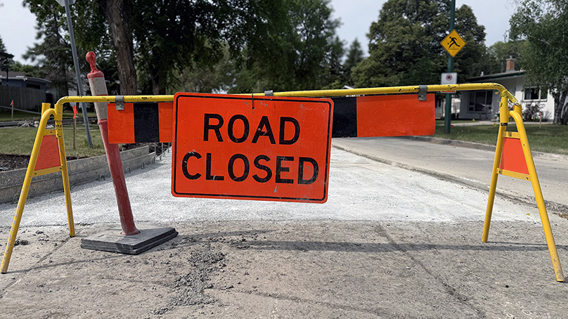 Road closed sign on a street under construction