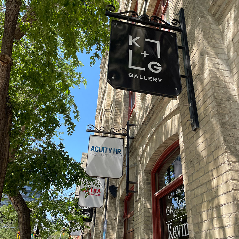 A sign strategy for multiple tenants was developed at 141 Bannatyne Avenue. If businesses change in the future, the sign faces could be replaced while the frames would remain mounted to the building. This creates visual consistancy and minimizes interventions.