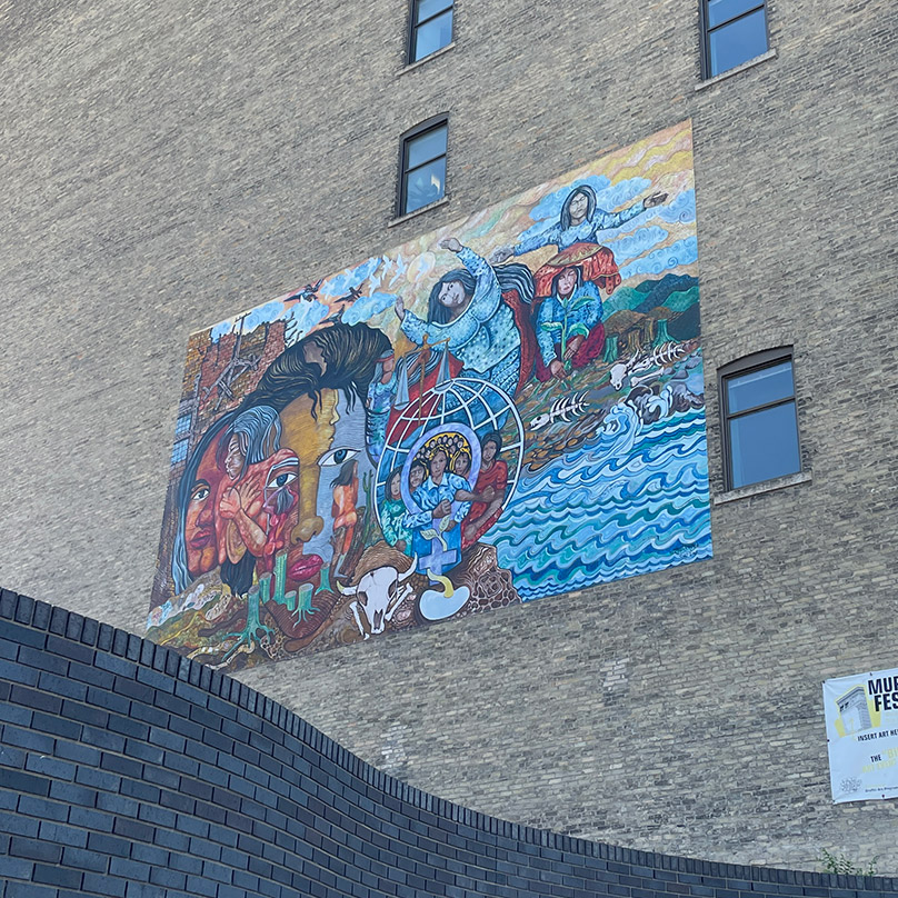 This mural on the Confederation Life Building was done on a fabric panel and installed on the plainer side elevation of the building. This is considered to be a reversible intervention. If it is removed, there will be few traces of it remaining.