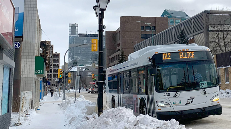D12 bus at a bus stop in the winter