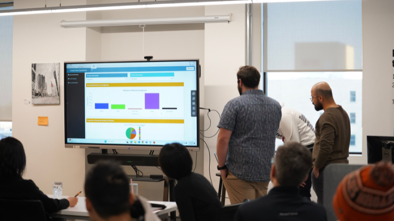 Participants viewing data visualizations on a screen