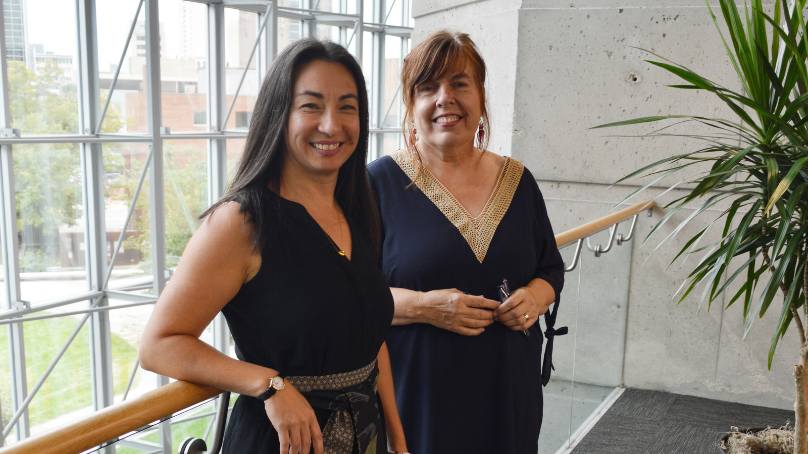 Makers-in-residence 2024 standing near the windows at the Millennium Library