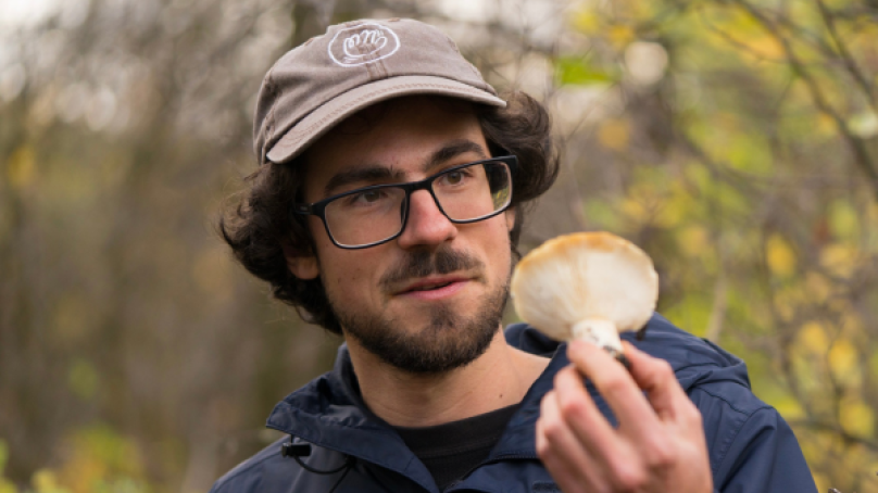 Tom Nagy, holding a mushroom.