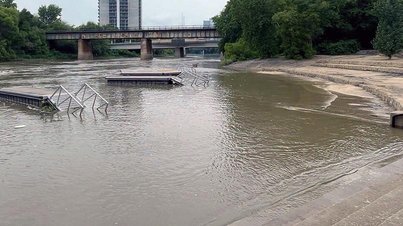 River water over a walkway at the Forks