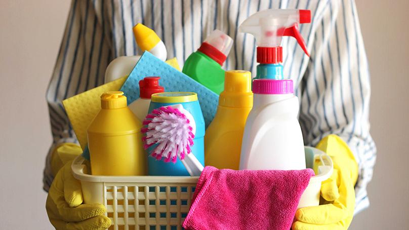 Cleaning supplies in a basket.