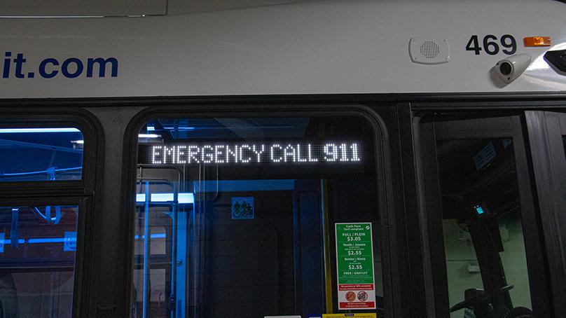 'Emergency Call 911' and 'Do Not Board Bus' is displayed on the front of the bus.
