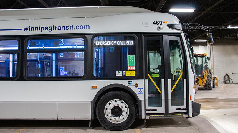 'Emergency Call 911' and 'Do Not Board Bus' is displayed on the front of the bus.