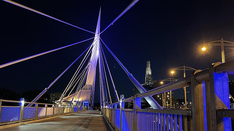 The new lighting system on Esplanade Riel can be programmed to illuminate the bridge in any colour.