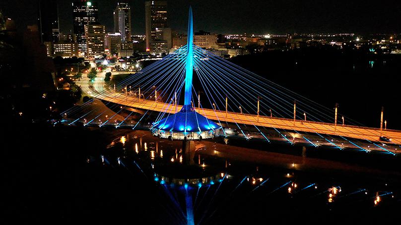 The new lighting system on Esplanade Riel can be programmed to illuminate the bridge in any colour. Photo credit: Field Service Canada