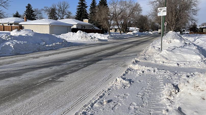 Crews have cleared the snow away from this bus stop in Winnipeg.