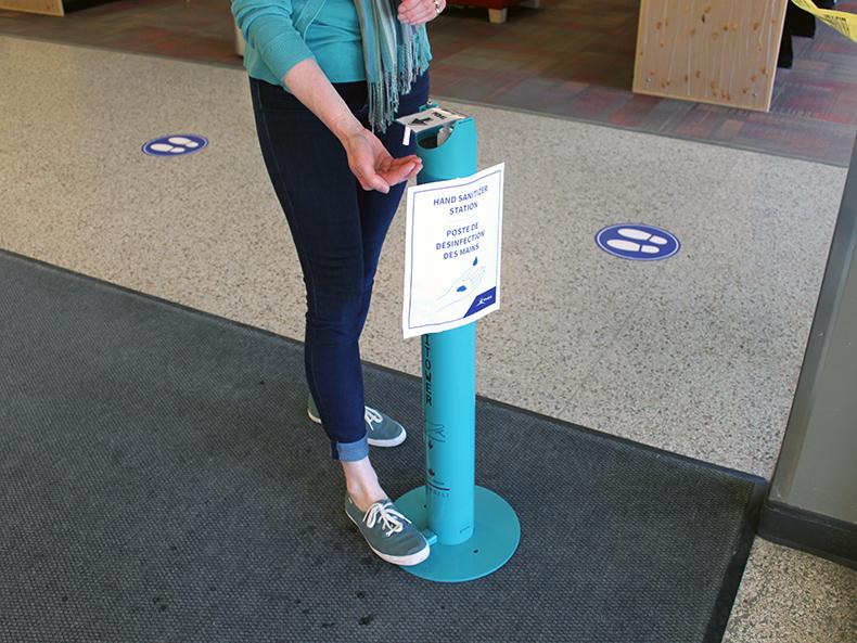 Hand sanitizer at the entrance of the Henderson Library.