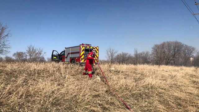 Winnipeg Fire Paramedic Service crews battle a wildland fire.