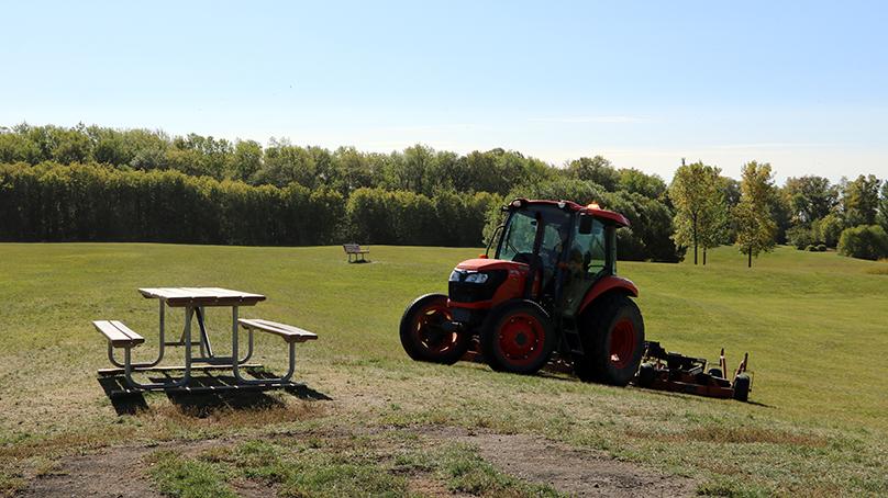 The Seasonal Labourer position tackles a variety of tasks, including grass cutting.