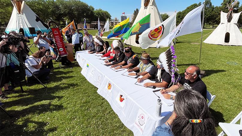The Gaawijijigemangit Agreement being signed. It is the services agreement for Naawi-Oodena.