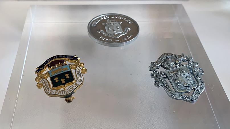 Items from the City of Winnipeg crest exhibit on display on the second floor of the Council Building at City Hall.