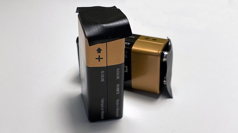 Covering battery posts with masking, duct, or electrical tape can help reduce the fire risk.