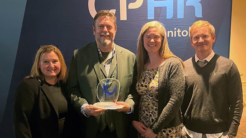 Angie Cusson (left), Director of Human Resources Services, with the team behind the Diversity Dashboard and their HR Excellence Award.