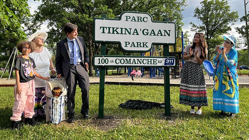 The sign unveiling event at Tikina'gaan Park.