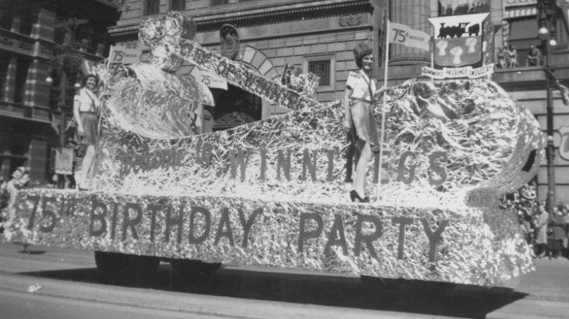 City of Winnipeg float on Main Street during Winnipeg's 75th Anniversary Parade