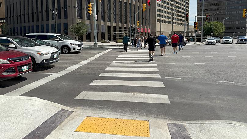 The sidewalk was designed in a way that guides people to where they need to cross.