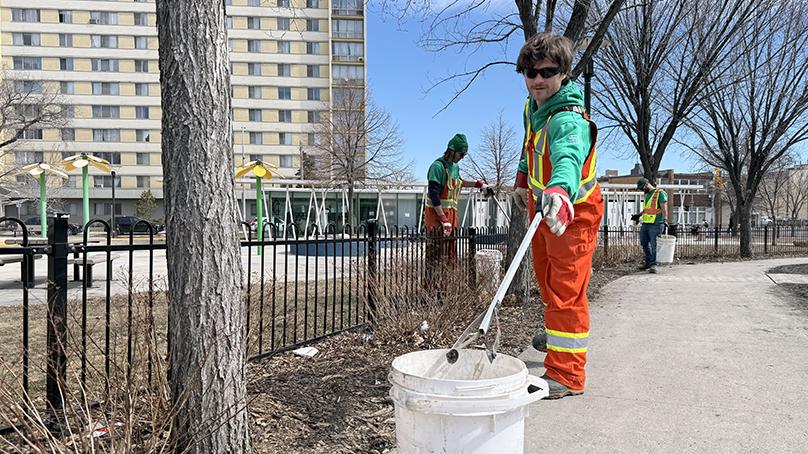 The Neighbourhood Action Team picks up debris in Central Park during the Downtown beautification blitz.