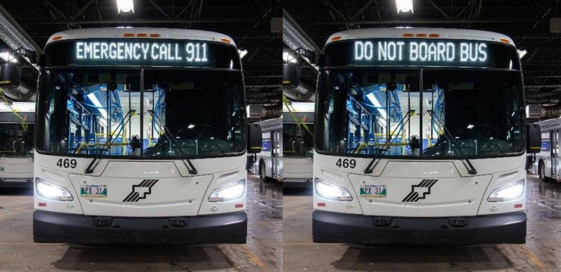 Bus displays on front of bus showing "Emergency call 911" and "Do not board bus"