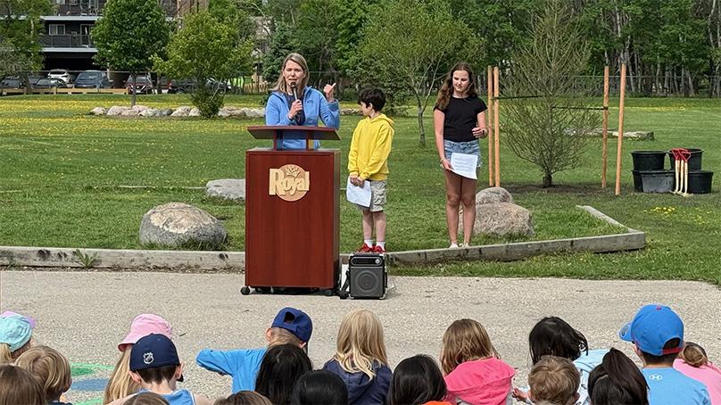 Martha Barwinsky, City Forester, speaks at an Arbor Day ceremony at Royal School.