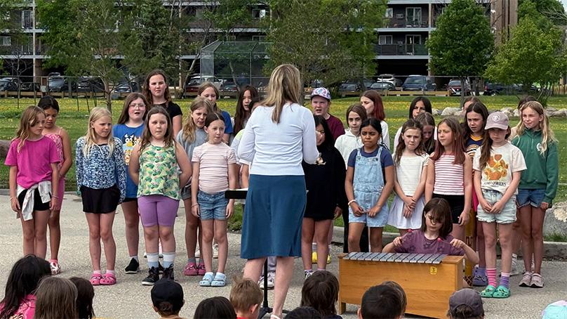 A student choir performs at an Arbor Day ceremony at Royal School.